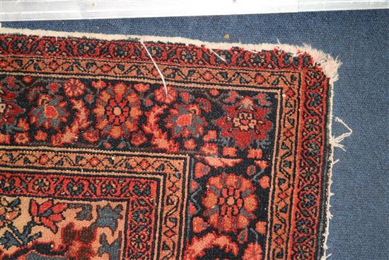 A Persian red ground rug 194 x 137cm